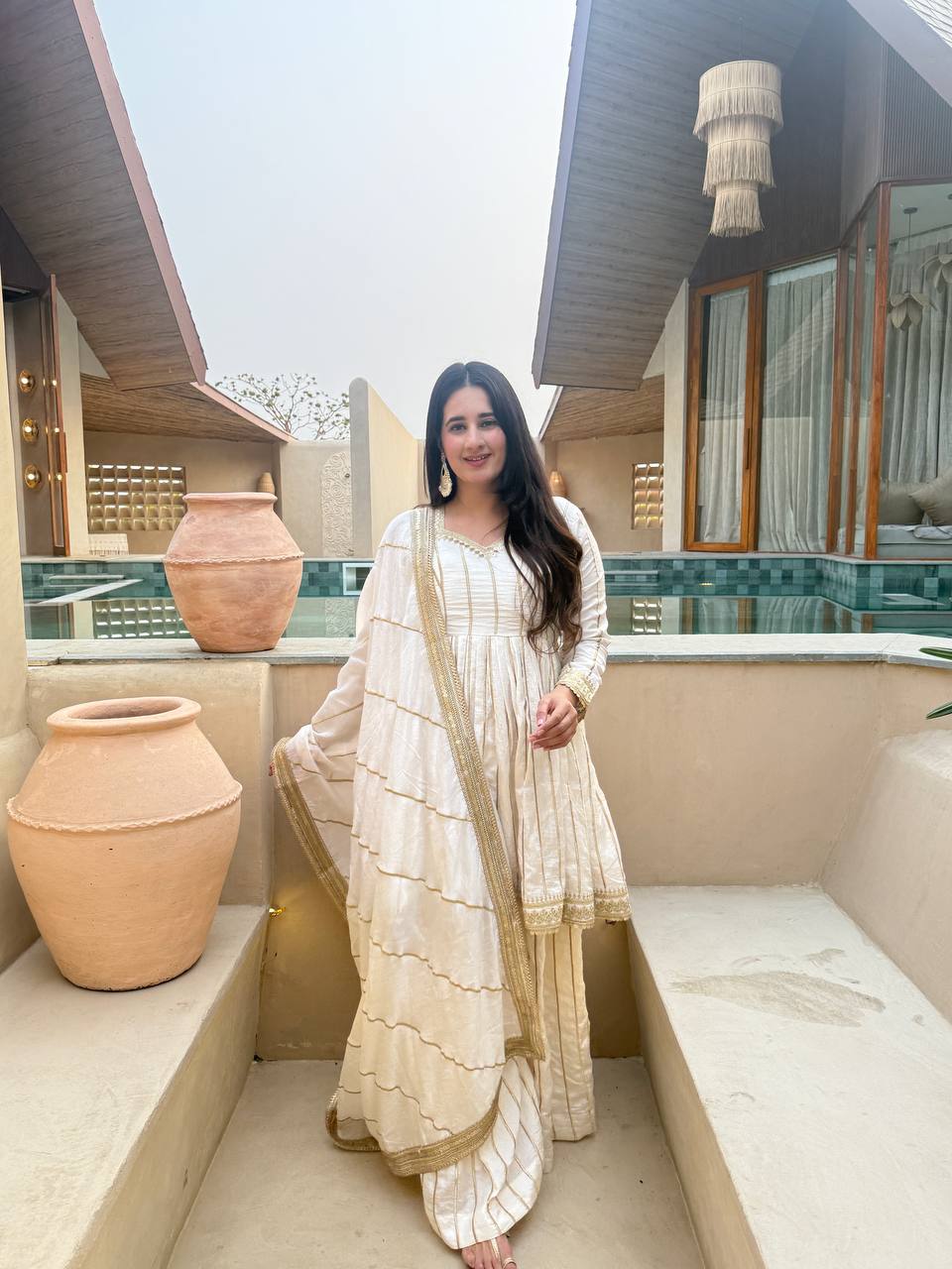 Radiant Rose Pink Flared Peplum Kurti and Sharara Set Embellished with Luminous Gold Zari Stripes and Sequined Borders